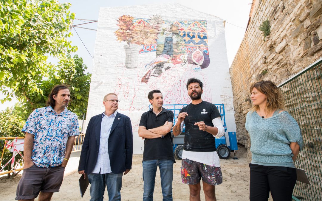 A large format mural artist Nicolás Romero Argentine woman kick-in “MMEU opencast”